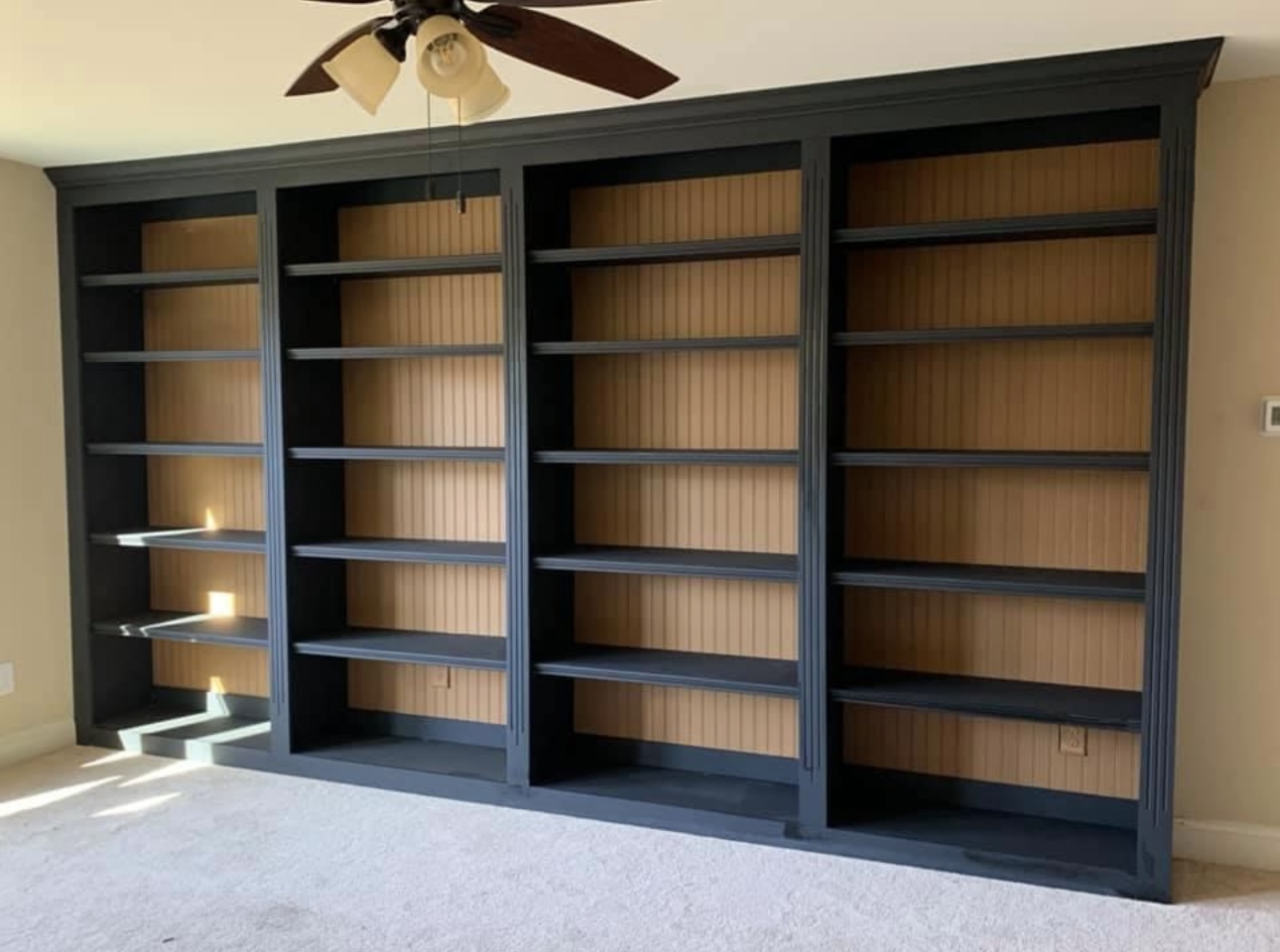 Black fluted bookshelf wall