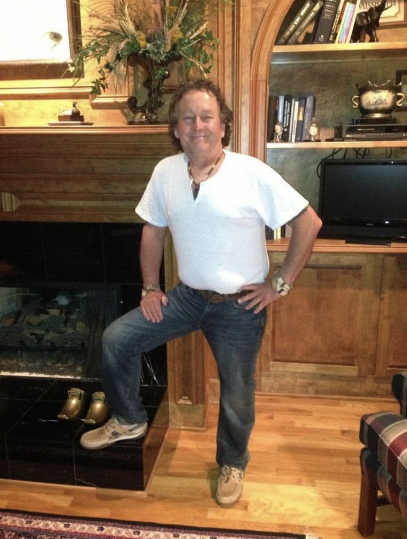 Kreg McMahon standing in a room of custom paneled millwork