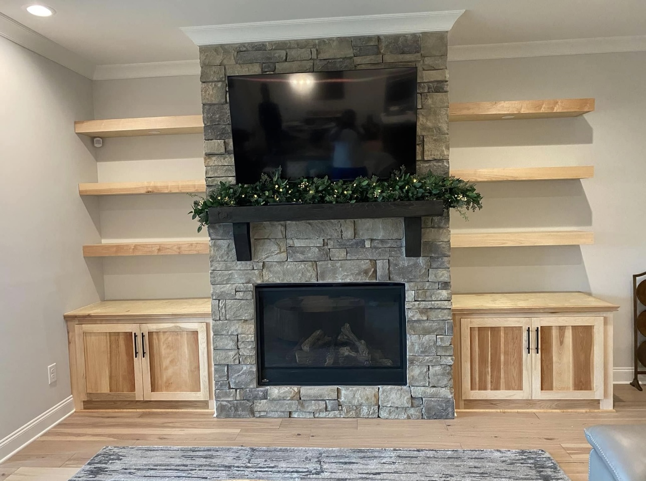 Rustic entertainment center with floating shelves