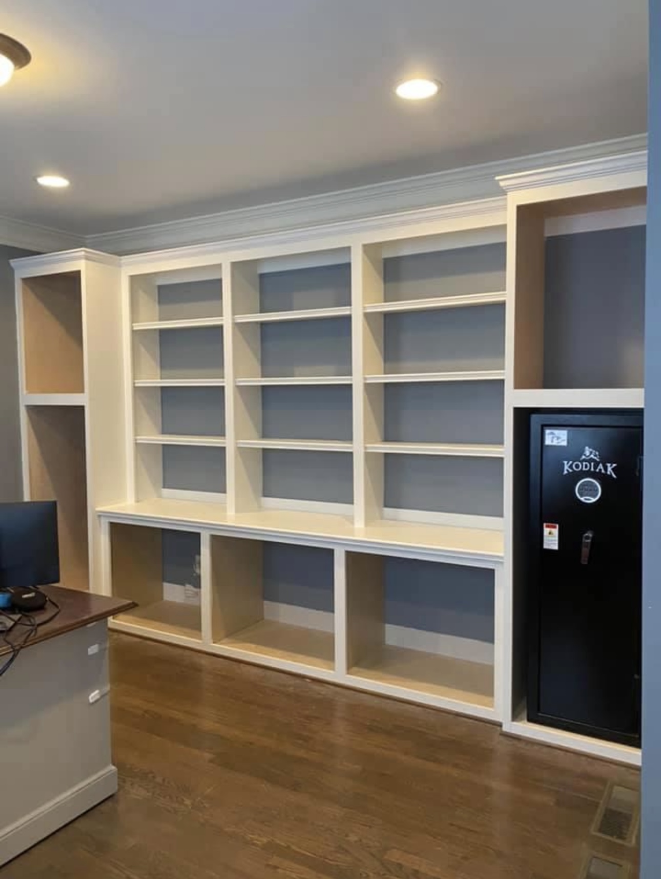 Office bookshelves with integrated gun safe