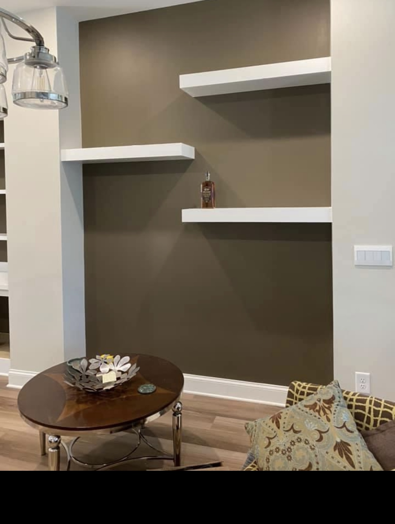 Three white floating shelves