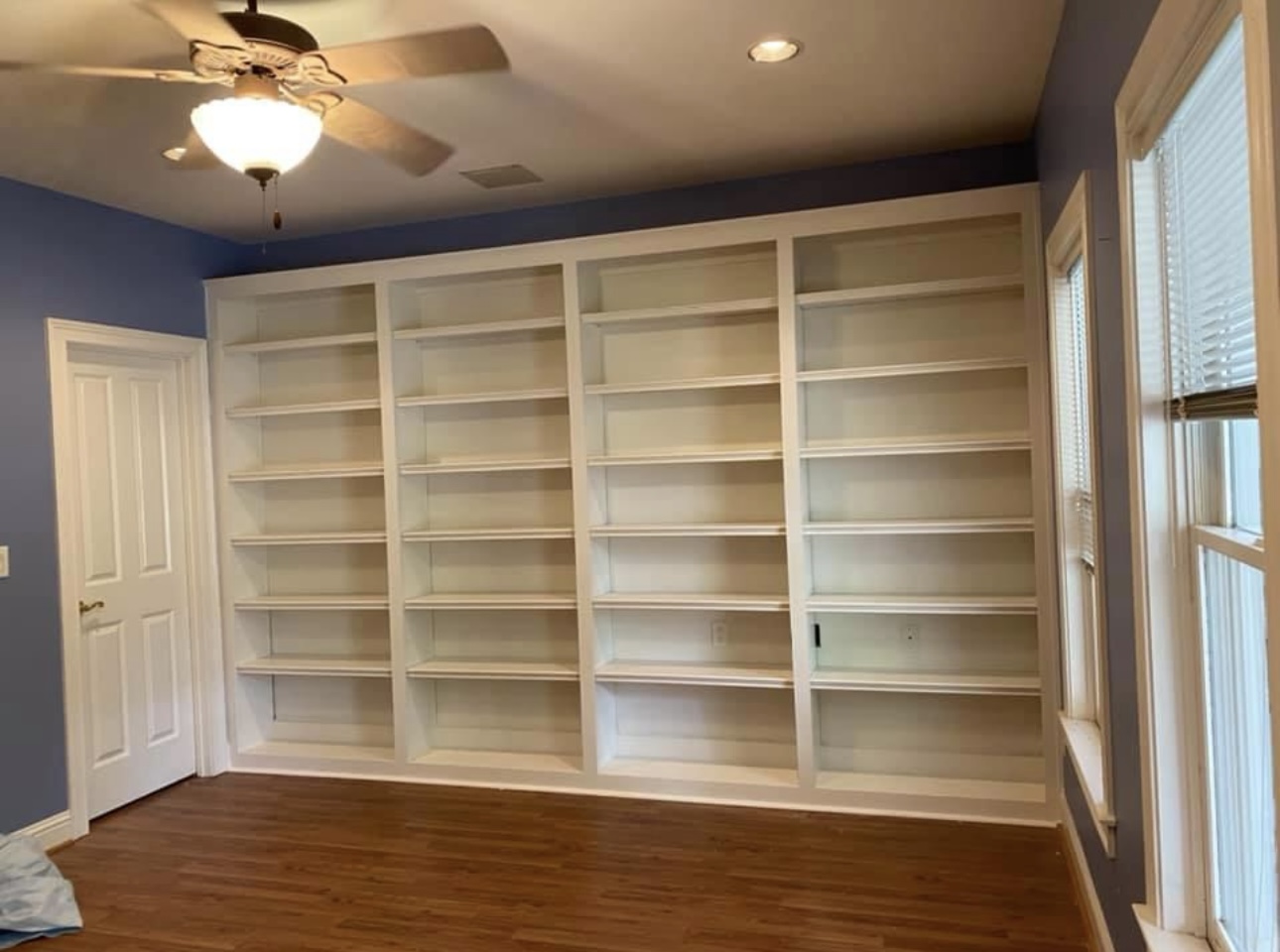 Four section white wall bookcases